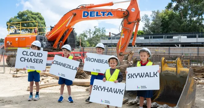 Cranezilla arrives in Port Melbourne along with some tiny helpers 