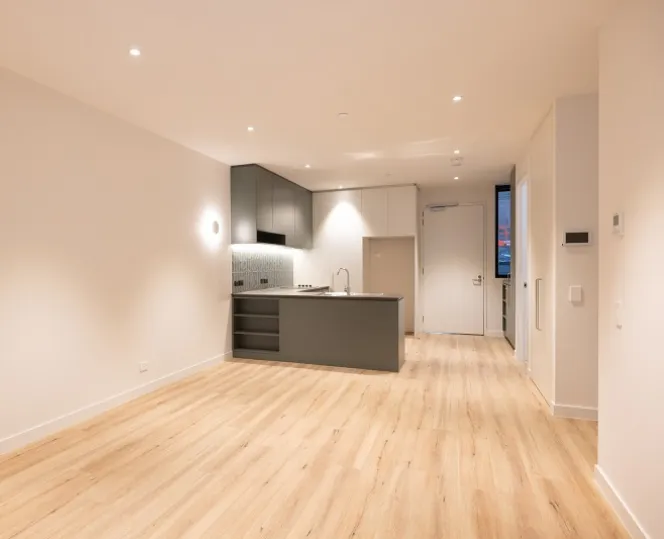 Image of wide drawing room with modern kitchen attached