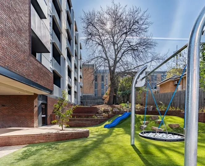 Image of Shared play space with surrounded by greenery