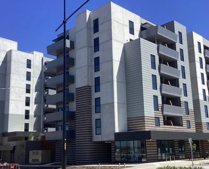 Imge of Apartment towers in front of blue sky