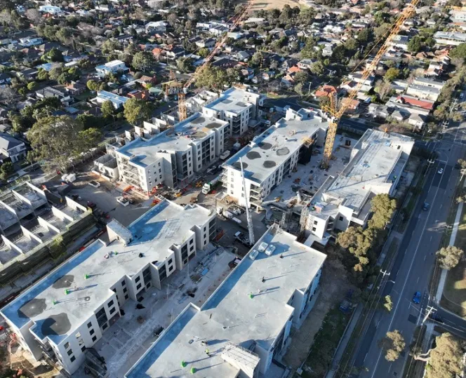 Image of cranes coming down at site