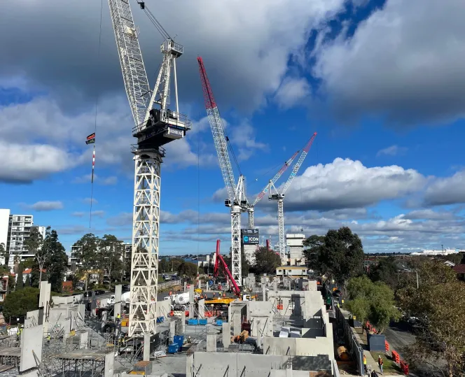 3 tower cranes on a construction site