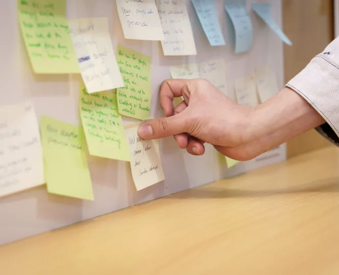 Image showing community feedback written on colourful post-it notes.