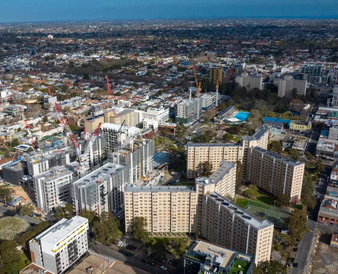 Aerial view of a tall residential building in South Yarra and Prahran, showing nearby streets and surrounding neighbourhood.