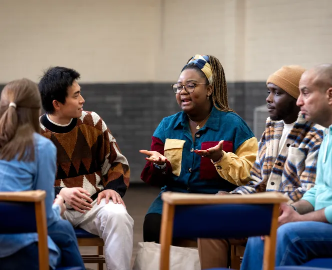 Image of people sitting together and having discussion 