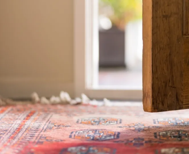 Picture of an open door and a carpet