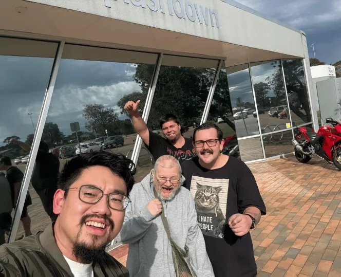 Selfie from a group of men cheering to the camera