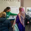 Image of staff and community at the information centre attending the session to find more about the project
