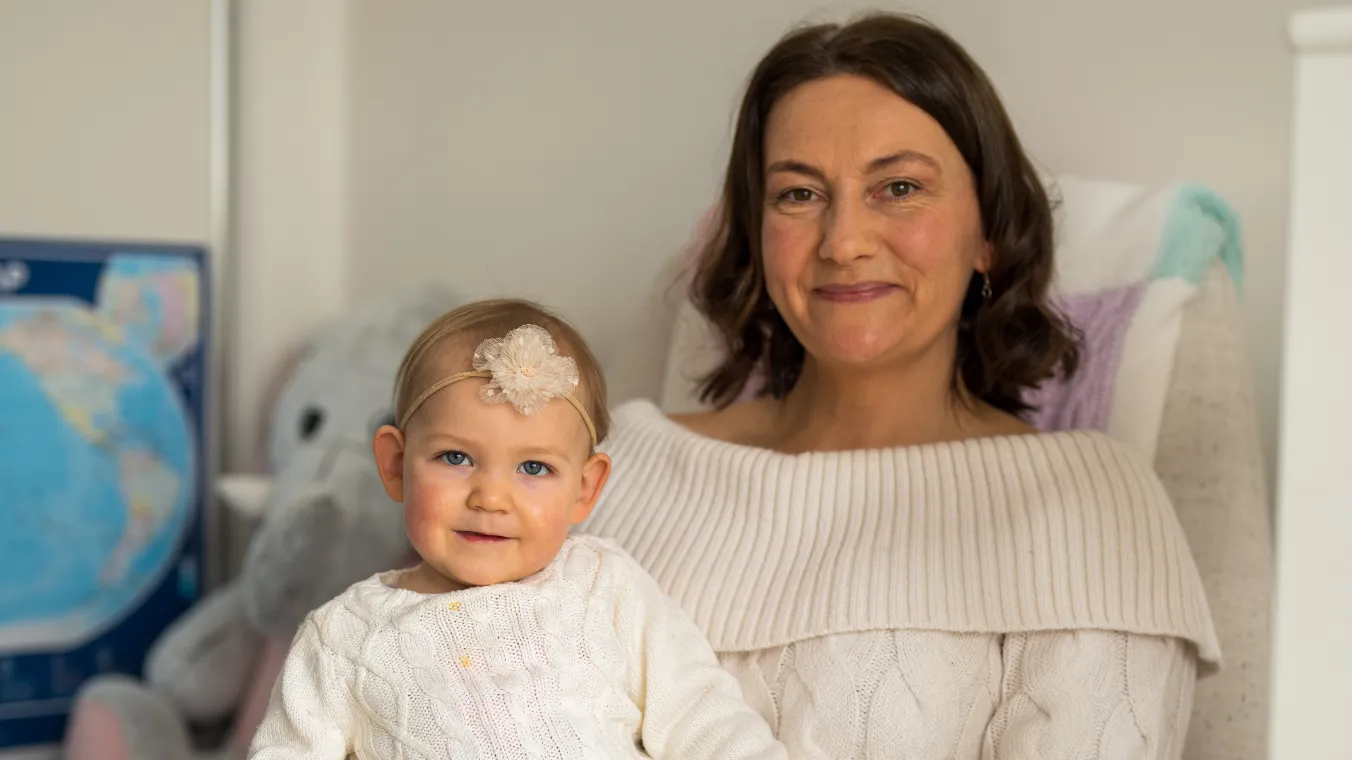 Image of a lady with her baby