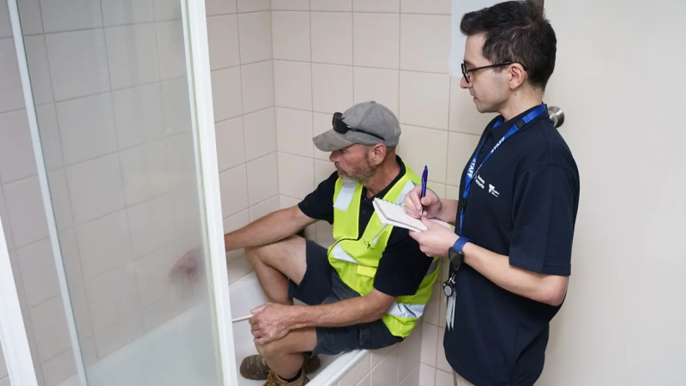 Image of new social housing repair crews fixing renters bathroom