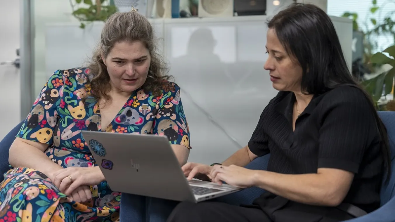 Image of two ladies with the laptop having discussion 