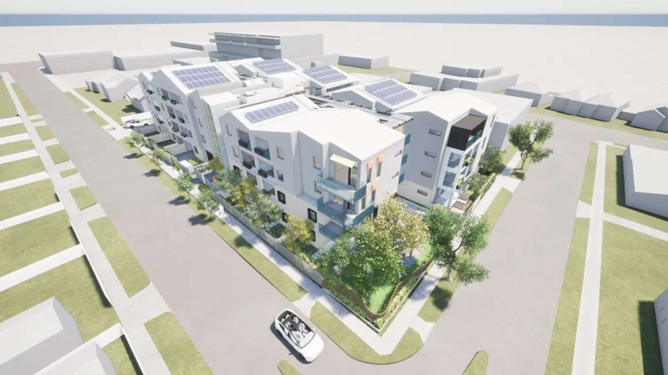 Artist’s render of attractive apartment building with solar panels on the roof, surrounded by lush landscaping and set against an open, blue sky