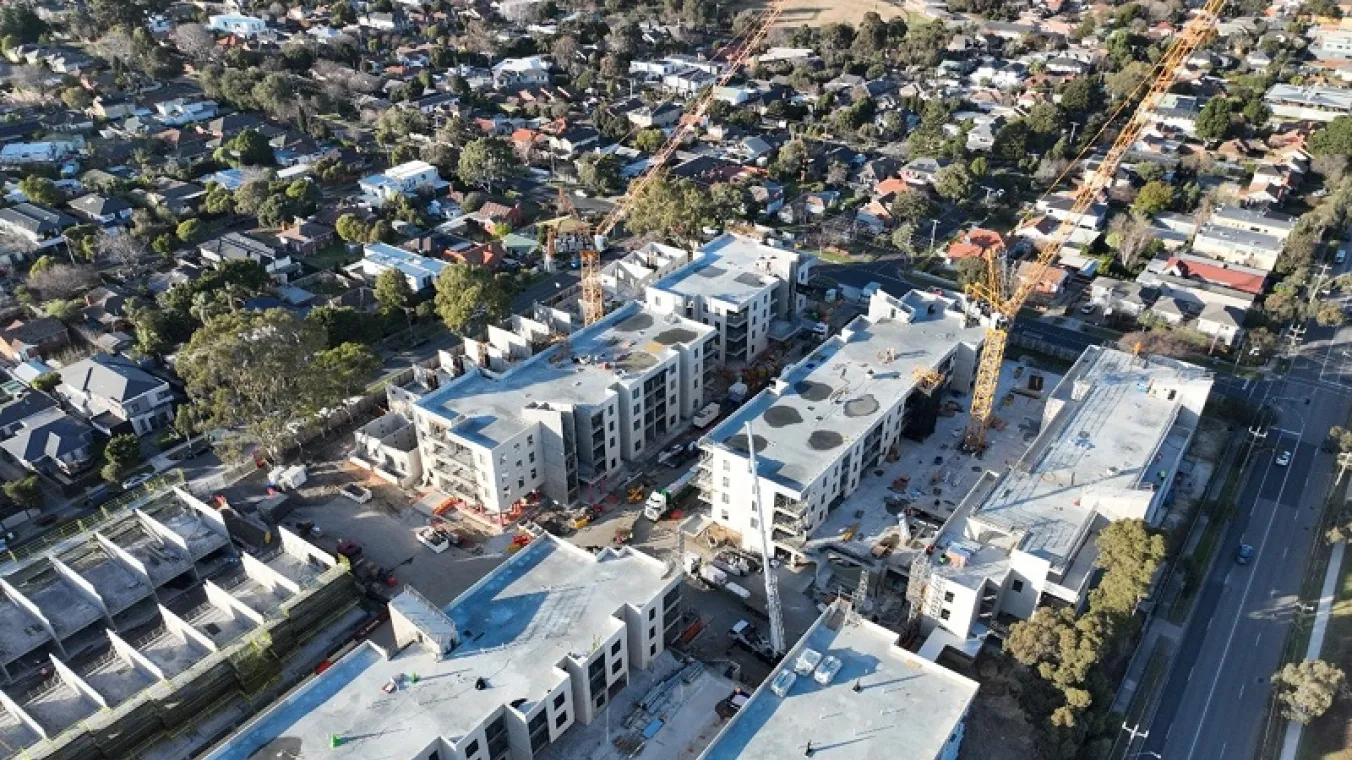 Image of cranes coming down at site