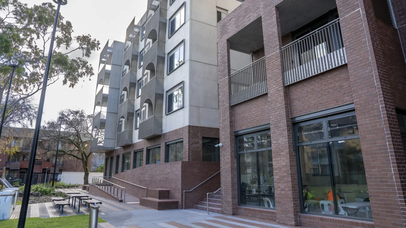 Image of tall building at Elisabeth street Richmond  with large windows and sitting area outdoor