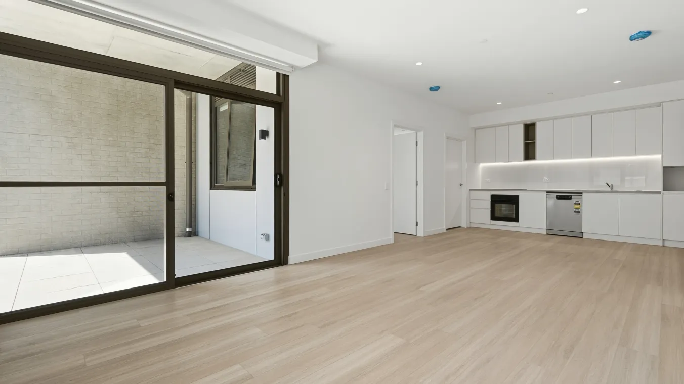 Living area opening onto a private balcony, with large sliding doors allowing natural light into the home.