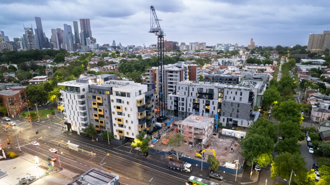 Aerial view of Elgin Towers in Carlton during demolition, showing the building structure and surrounding area.