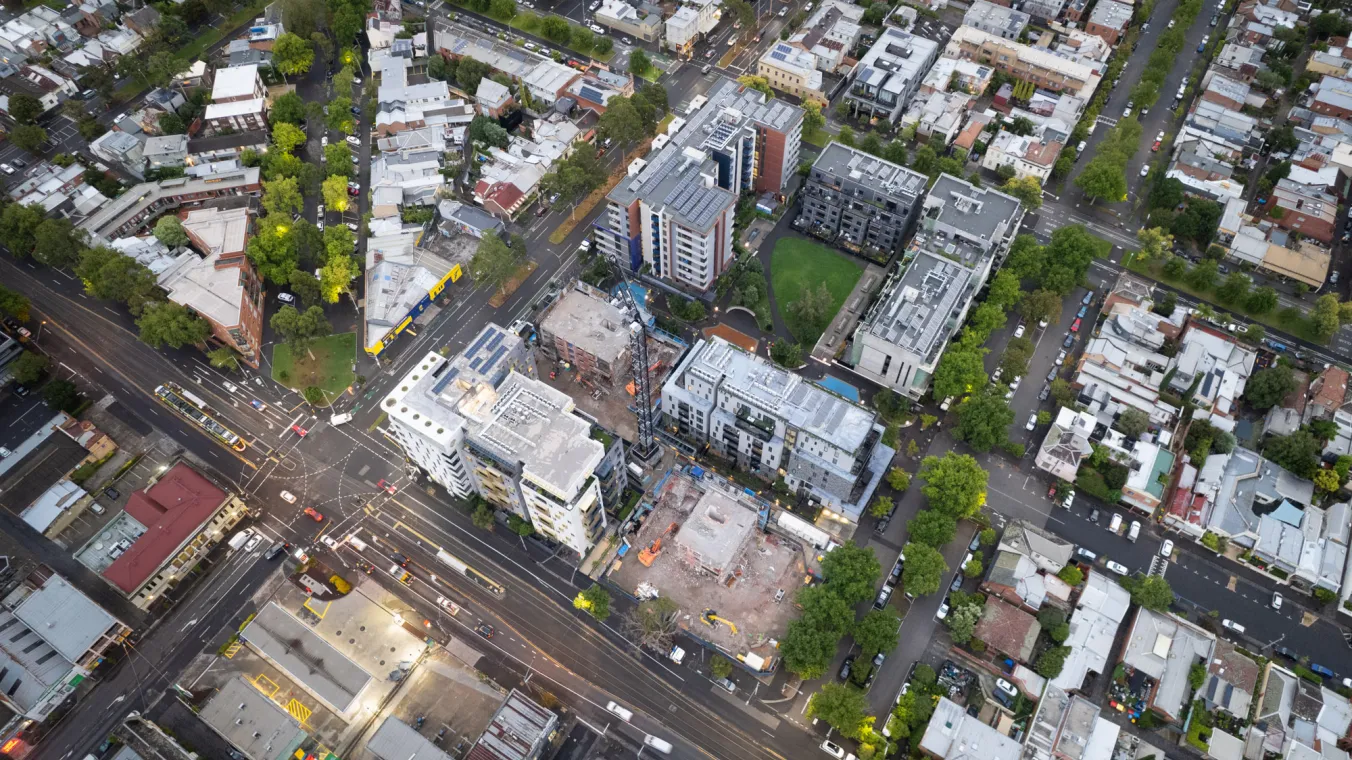 Aerial view of Elgin Towers in Carlton during demolition, showing the building structure and surrounding area.  