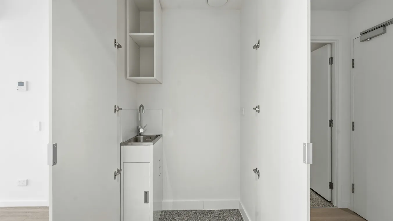 European laundry with additional storage space.