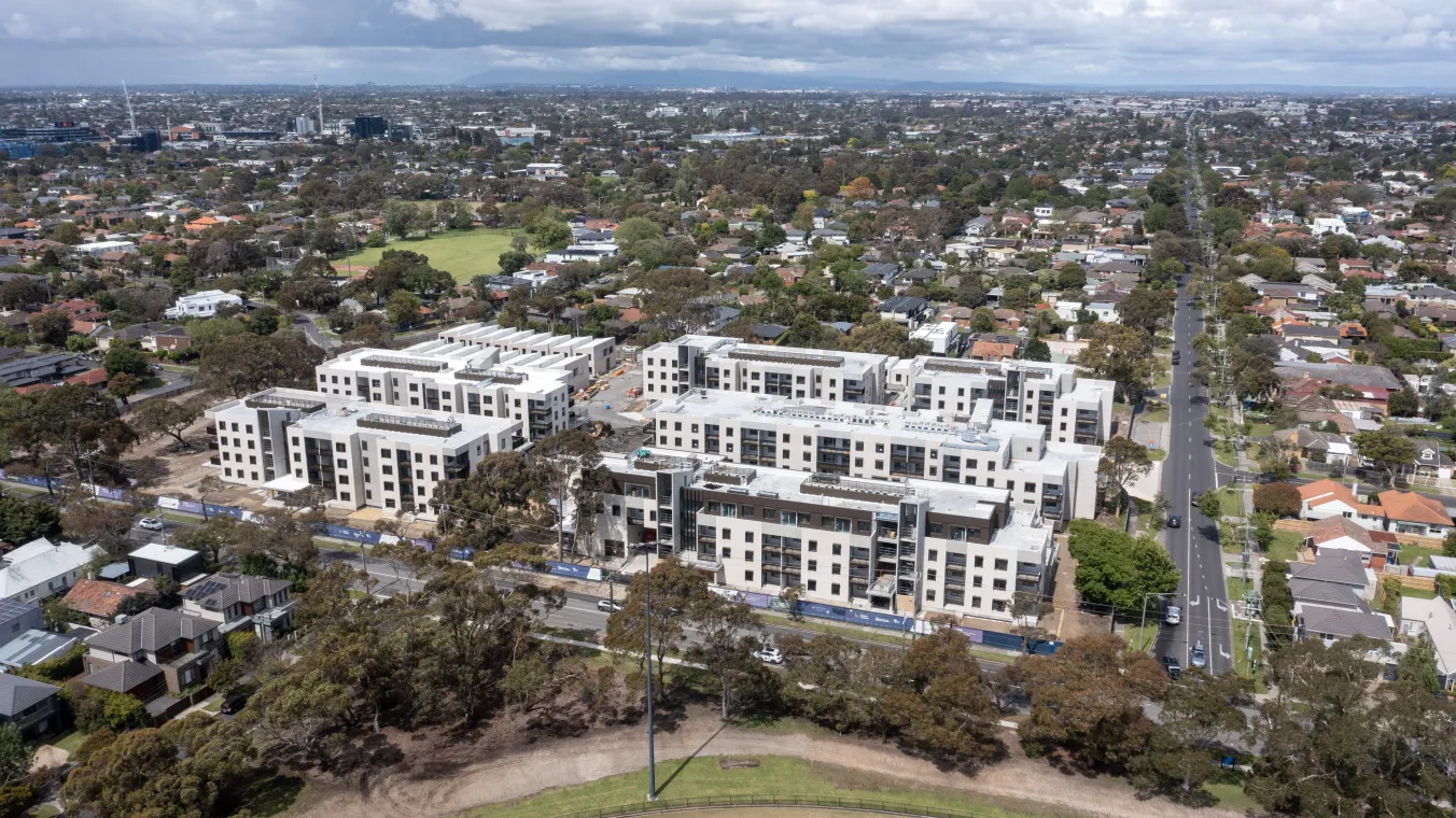 Aerial view of the Bluff Road Hampton East apartment surrounded by trees and nearby residential streets