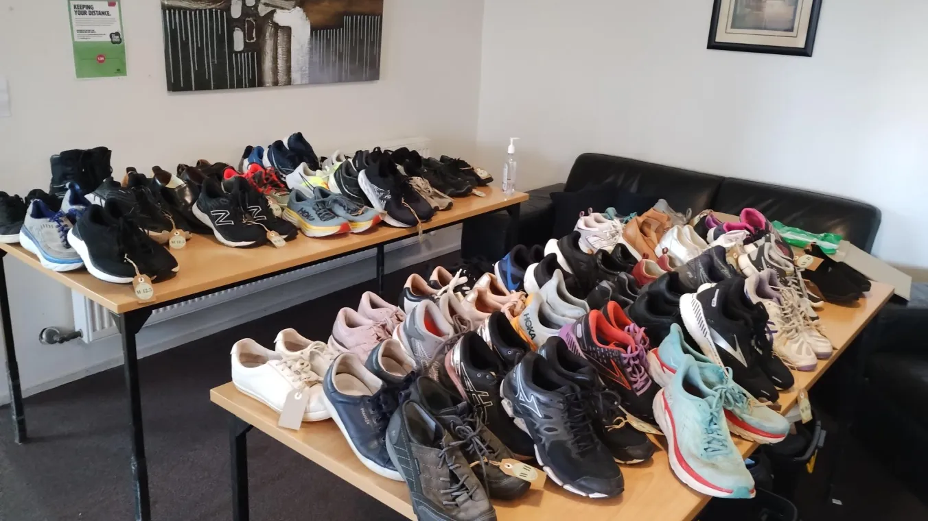 Tables with lots of pairs of shoes